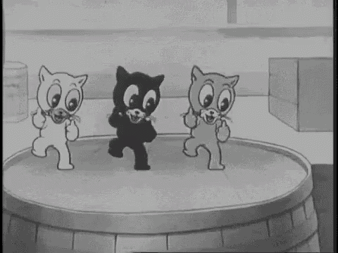 a black and white cartoon of three cats dancing on a barrel .