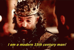 a man with a crown on his head is saying i am a modern 13th century man