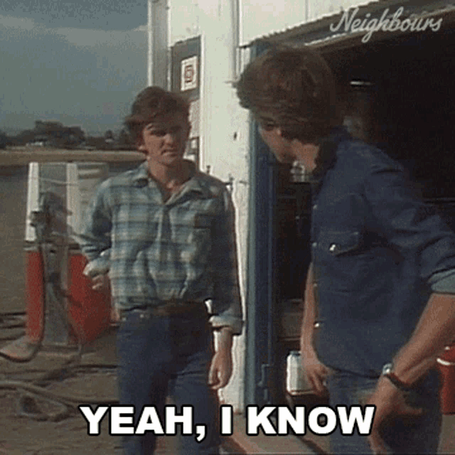 two men are standing next to each other and one of them is saying " yeah , i know "