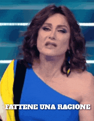 a woman in a blue one shoulder dress with the words fattene una ragione on the bottom