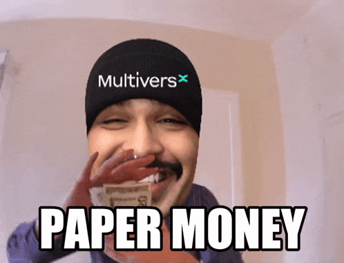 a man wearing a hat that says multivers on it is holding money