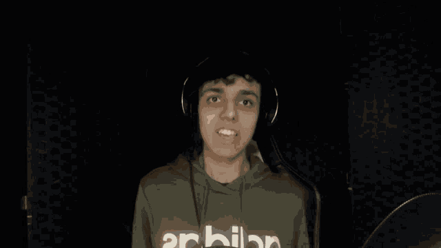 a person wearing a hoodie that says adidas