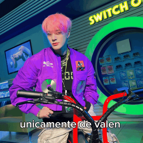 a man in a purple jacket is riding a bike in front of a sign that says " switch "