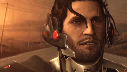 a man with a beard wearing a helmet with a red button