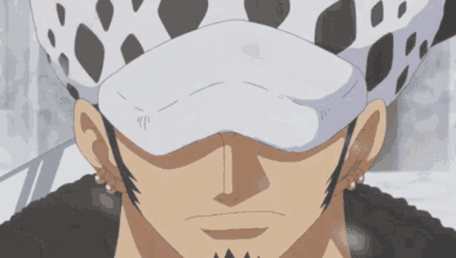 a close up of a man 's face with a white hat on