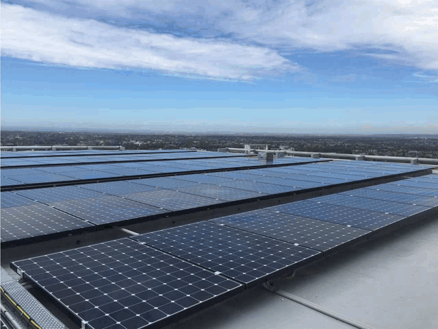 a row of solar panels on top of a roof