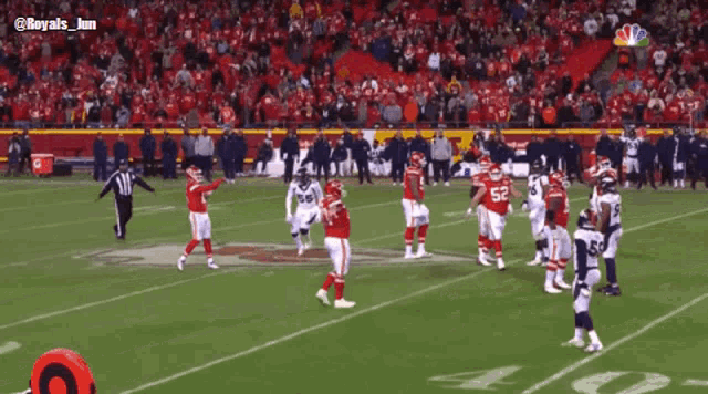 a football game is being played in front of a crowd with the hashtag royals_jun