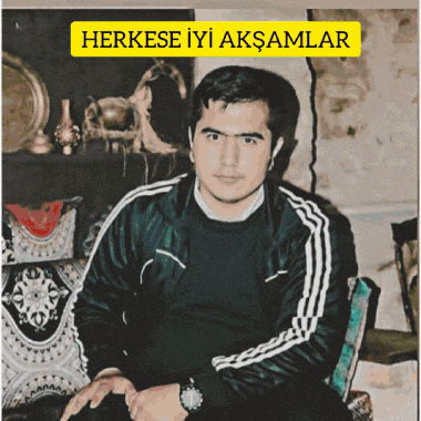 a man in a black jacket sits in a chair with the words herkese iyi aksamlar above him