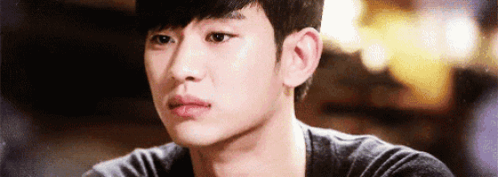 a close up of a young man 's face with tears running down his face .