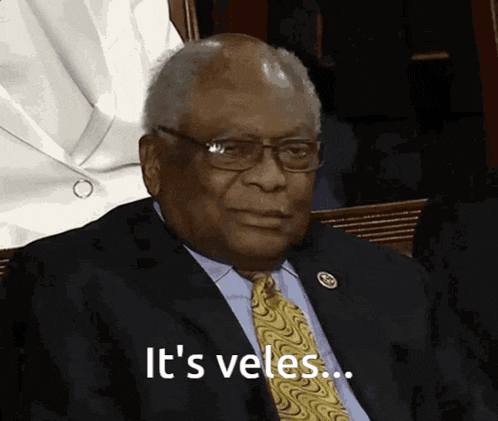 a man in a suit and tie says " it 's veles ... "