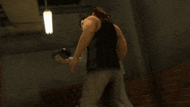 a man in a suit is covering another man 's mouth in a video game