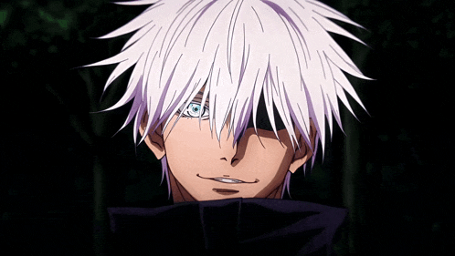 a man with white hair and blue eyes is smiling