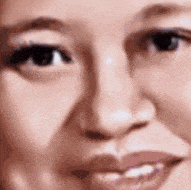 a close up of a woman 's face shows her eyes and mouth