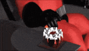 a cartoon character is sitting in a chair eating a cake that says true