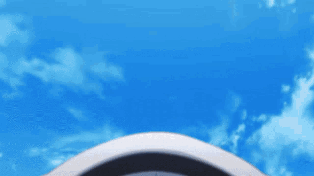a blue sky is behind a white object