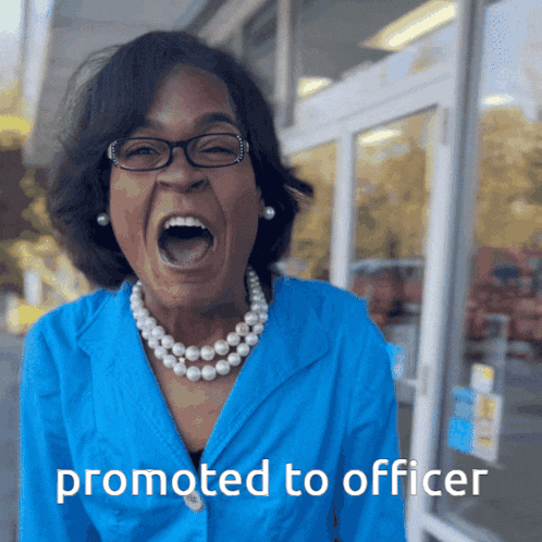 a woman wearing glasses and a pearl necklace is screaming with the words promoted to officer behind her