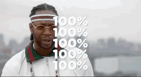 a man wearing sunglasses and a headband with the words `` 100 % '' written above him .
