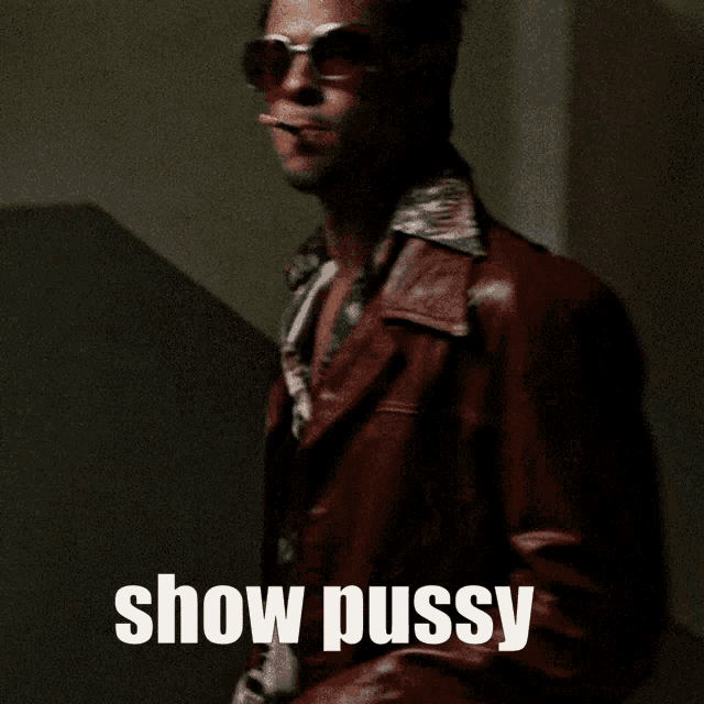 a man in a leather jacket smoking a cigarette with the words show pussy written below him
