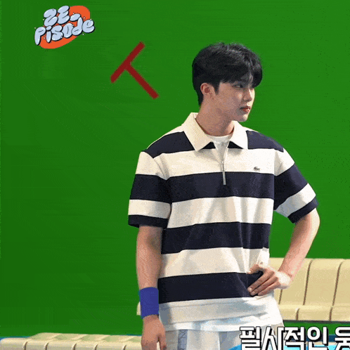 a man wearing a blue and white striped shirt is standing in front of a green screen that says ze episode on it