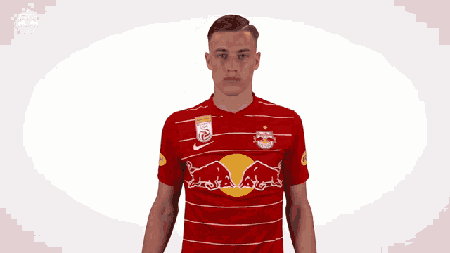 a man wearing a red bulls jersey with the number 21 on it