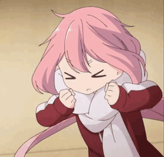 a girl with pink hair is wearing a scarf and making a funny face .