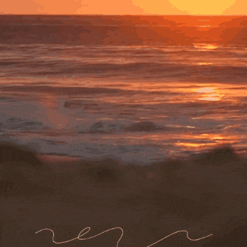 a sunset over a body of water with the letter r written in the foreground
