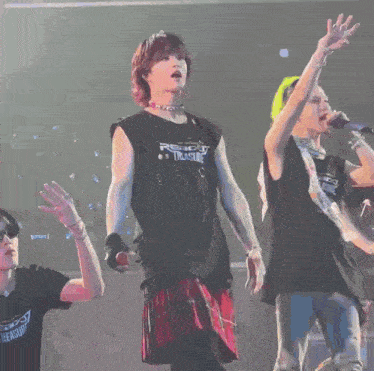 a man in a black tank top that says ready treasure on it