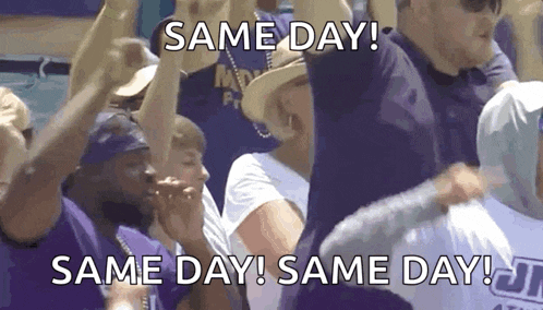 a group of people are holding up signs that say same day same day same day !