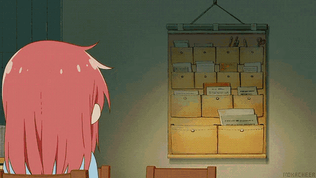 two anime girls are standing next to each other in front of a shelf of boxes