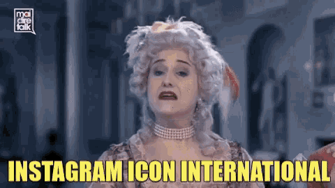 a woman in a wig with the words instagram icon international on the bottom