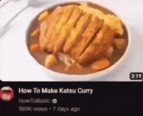 a bowl of katsu curry with meat and vegetables