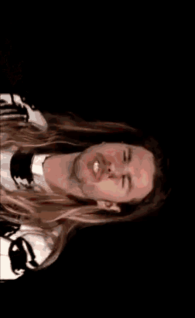 a person is laying on the floor with a red light coming out of their head
