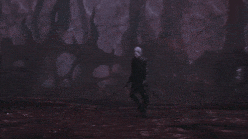 a person standing in front of a purple lightning circle