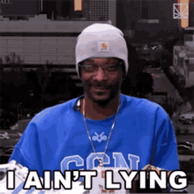 snoop dogg wearing a blue shirt that says i ain t lying