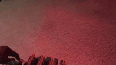 a person is holding a gun in front of a sign that says emergency