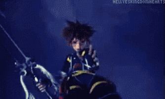 sora from kingdom hearts is pointing at the camera with his finger .