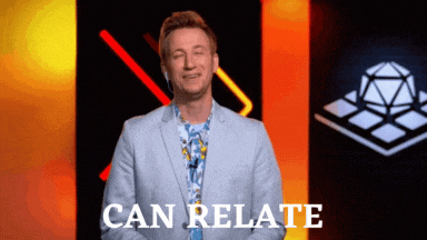 a man in a suit says " can relate " while smiling