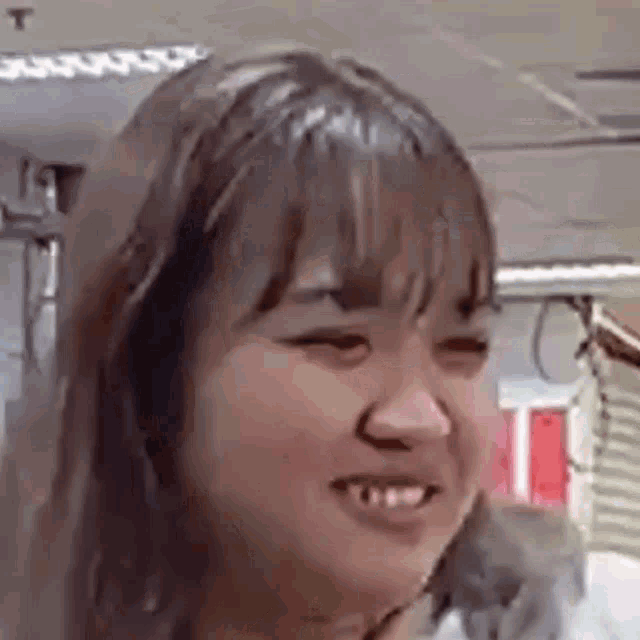 a close up of a woman 's face with a funny face .