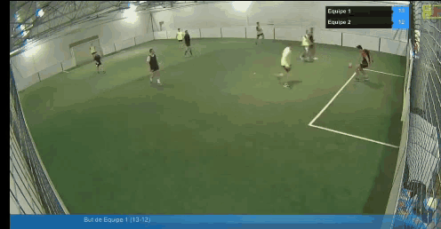 a group of people are playing a game of soccer and the scoreboard shows equipe 1 and equipe 2