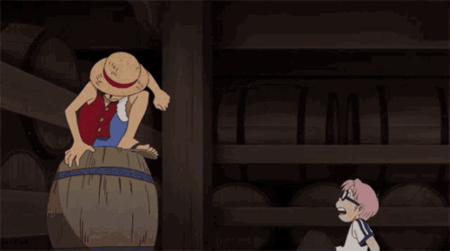 a man in a straw hat is standing on a barrel