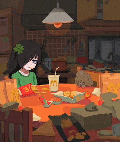 a girl is sitting at a table with a mcdonald 's drink