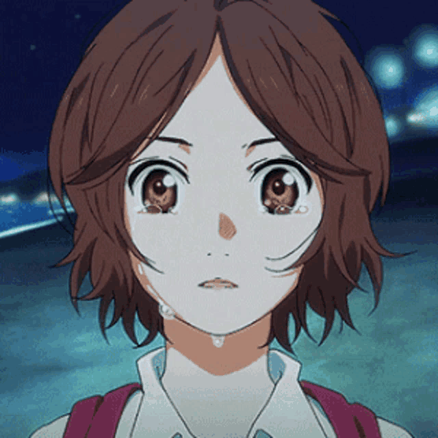a close up of a girl 's face with tears running down her face
