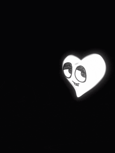a drawing of a heart with big eyes and a mouth drawn on it