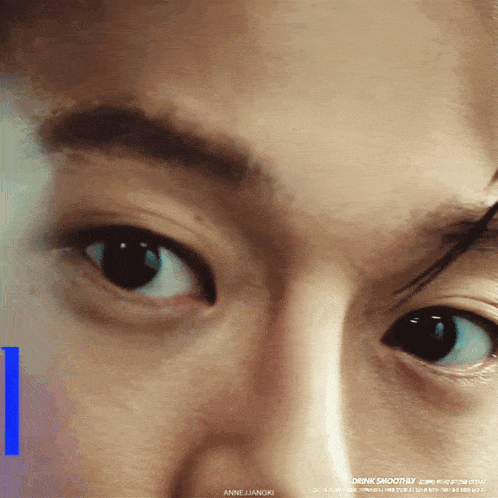 a close up of a person 's eye with the words drink smoothly written on the bottom