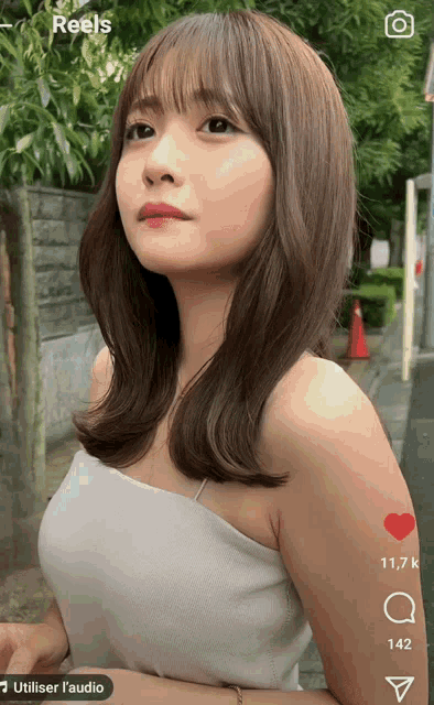 a screen shot of a woman with the word reels on the top left