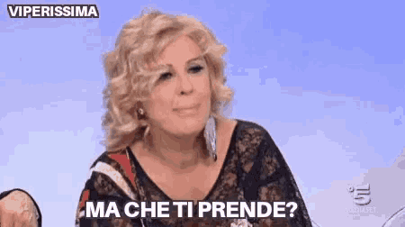 a woman is talking on a television show and says ma che ti prende
