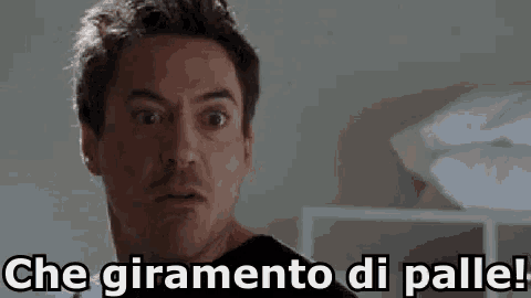 a close up of a man 's face with the words `` che giramento di palle '' written below him .