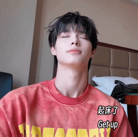 a person wearing a red shirt that says get up on it