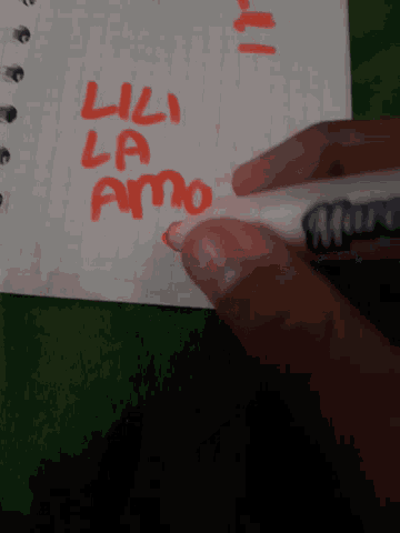 a person is writing on a piece of paper with a marker that says " llama "