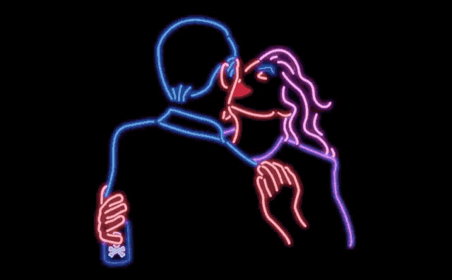 a neon sign of a man and a woman kissing .